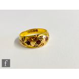 An 18ct hallmarked gypsy set ruby and diamond five stone ring to scroll shoulders, weight 2.8g, ring