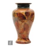 An early 20th Century Royal Doulton Autumnal Leaves vase decorated to the body with impressed leaves