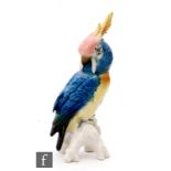 An early 20th Century Karl Ens model of a stylised parrot perched upon a branch, printed mark,