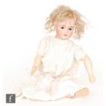 An early 20th Century doll by Simon and Halbig for Kammer and Reinhardt, bisque socket head in dolly