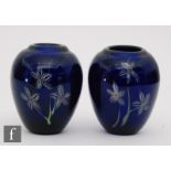 A pair of early 20th Century glass vases of ovoid form, each decorated in the manner of Clichy