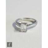 A platinum diamond solitaire ring, rectangular step cut claw set stone, 0.77ct, colour D, clarity IF