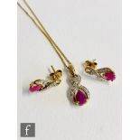 A modern 9ct hallmarked ruby and diamond pendant and earring set, pendant suspended from a 9ct trace