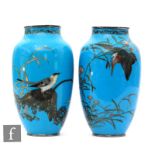 A pair of Chinese cloisonne vases, each of slender ovoid form, the blue ground of each detailed with