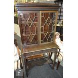 An early 20th Century mahogany collectors cabinet in the Chippendale revival taste, the galleried