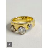 A contemporary 18ct diamond three stone ring three cut collar set stones, largest approximately 1.