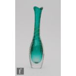 A post war Italian Murano sommerso glass vase of bottle form with wave rim, cased in clear over