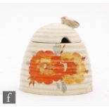 A Clarice Cliff beehive preserve pot decorated in the Honeydew pattern, printed script Newport mark,
