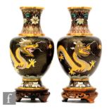 A pair of Chinese cloisonne vases, each of baluster form, rising from a splayed foot, the black