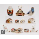 Thirteen assorted Royal Crown Derby paperweights to include Santa Clause, three hedgehog, five small