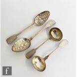 A pair of hallmarked silver fiddle pattern sauce ladles with a pair of table spoons with later berry