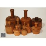 A collection of ten beech butter moulds with various designs in dumbbell form. (10)