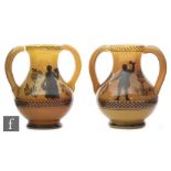A pair of mid 19th Century caramel vases of footed ovoid form with slender neck and applied loop