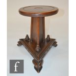 A Victorian oak circular candle stand on tricot base and splayed feet, height 33cm