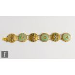 An early 20th Century Chinese silver gilt six circular panelled bracelet decorated with three