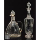A 19th Century decanter of footed sleeve form with waisted collar neck engraved with stylised leaves