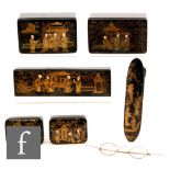 Two late 19th Century Japanese chinoisserie lacquered boxes decorated with figures in gilt on a