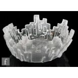 A later 20th Century cast glass bowl by Youquing Li, formed as a frosted and stylised cityscape with