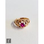 A Continental 14ct synthetic ruby single stone ring, claw set stones to pierced shoulders, weight