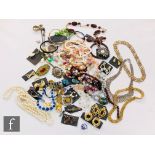 A parcel lot assorted costume jewellery to include rings, earrings, bangles, beads, brooches etc.