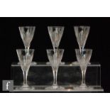 A set of six early 19th Century clear sherry glasses, each with conical bowl with basal flute cut