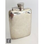 A hallmarked silver cushioned rectangular hip flask of plain form terminating in bayonet cap, length