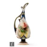 A late 19th Century Hadleys Worcester pedestal ewer decorated with single rose buds and foliage with