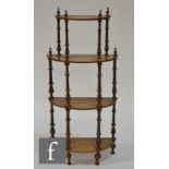 A Victorian four-tier graduated what-not with spiral turned columns and with urn-shaped inlaid