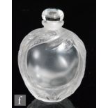 A Lalique scent bottle of compressed ovoid form, relief moulded with stylised leaves and flowers