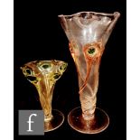 Two early 20th Century Stuart and Sons glass vases, each of footed flared form with petal rim, the