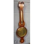 An early 19th Century mahogany wheel barometer with inlaid floral and shell paterae, with an