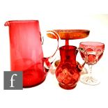 A collection of Victorian and later ruby glass, to include a wine glass with ovoid bowl cased in