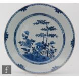 A Chinese 18th Century blue and white charger, or circular for, the shallow well detailed in rich