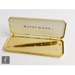 A 9ct hallmarked Waterman's propelling pencil with engine turned decoration to whole, engraved