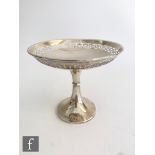 A hallmarked silver pedestal bon bon dish of plain form with geometric cut borders to circular bowl,