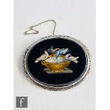 A late 19th Century micro mosaic brooch depicting the Doves Of Pliny to a black ground within a