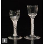 An 18th Century drinking glass circa 1765, the ogee bowl above a double series opaque twist stem