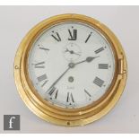 A Sestrel brass cased bulkhead clock with seconds date aperture, width 22cm, S/D.