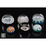 A collection of six Scottish paperweights to include a boxed Perthshire scramble glass example,