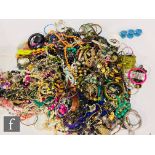 A large parcel lot of assorted modern costume jewellery to include beads, bangles, bracelets,