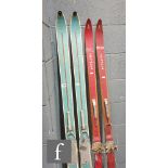 A pair of early 20th century blue painted Swiss Attenhof wooden skis, length 193cm and a similar