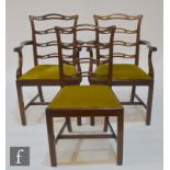 A set of six early 20th Century mahogany dining chairs in the Georgian style, with pierced ladder