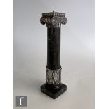 A silver and marble candlestick modelled as an Ionic column with Classical figure details to the