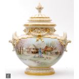 A large early 20th Century Royal Worcester pomander and cover with twin handles and relief moulded