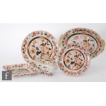 A collection of 19th Century Ashworth Ironstone dinner wares decorated in a gilt Imari palette