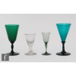 A 19th Century green drinking glass with conical bowl, the plain stem below an upper bladed knop,