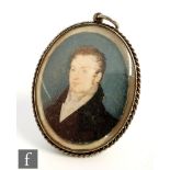 A 19th Century oval miniature, head and shoulder portrait of a young man, plaited hair to reverse,