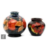 Two Moorcroft vases, the first of ovoid form decorated in the Pomegranate pattern with a band of