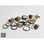 Sixteen assorted silver rings to include enamelled and stone set examples, various styles and sizes,