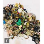 A large parcel lot of assorted modern costume jewellery to include beads, bangles, bracelets,